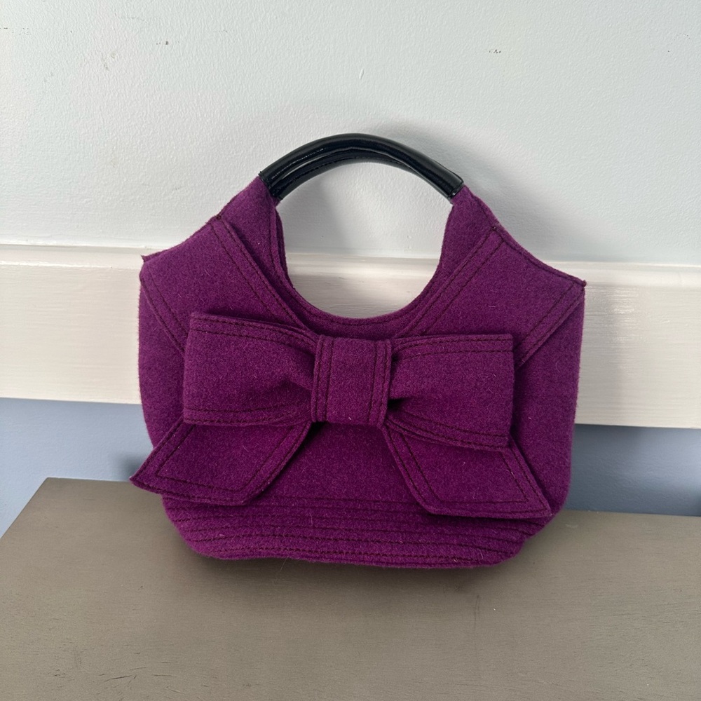 Kate Spade purple wool bow purse with black straps.